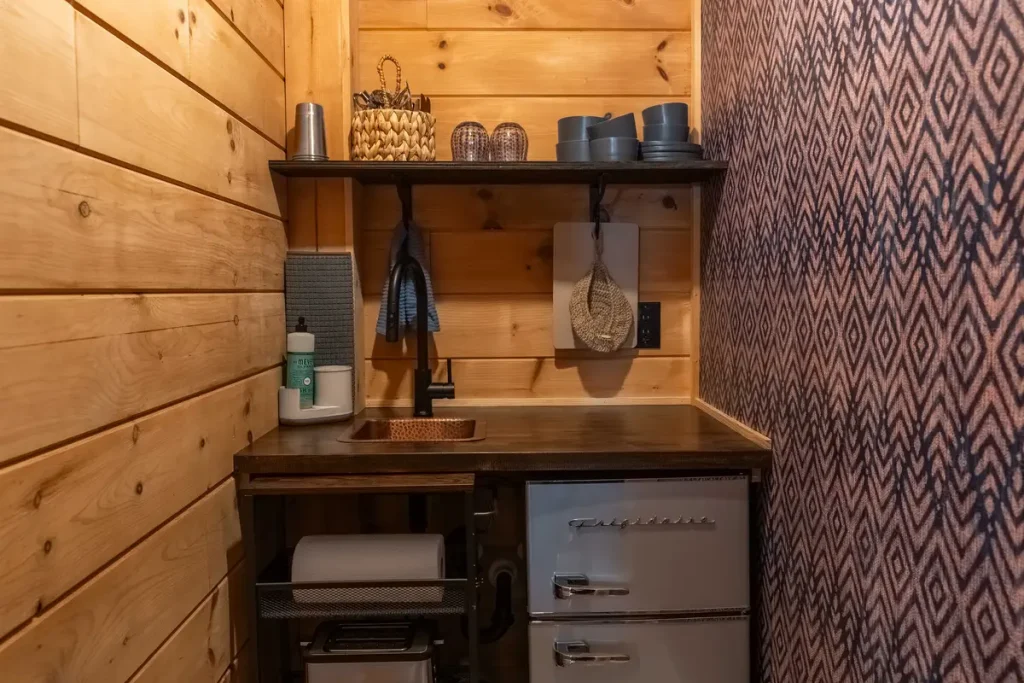 Kitchenette with mini fridge, microwave, coffee maker, and sink inside Garden Studio A at The Shaded Crest in Lake Lure, North Carolina