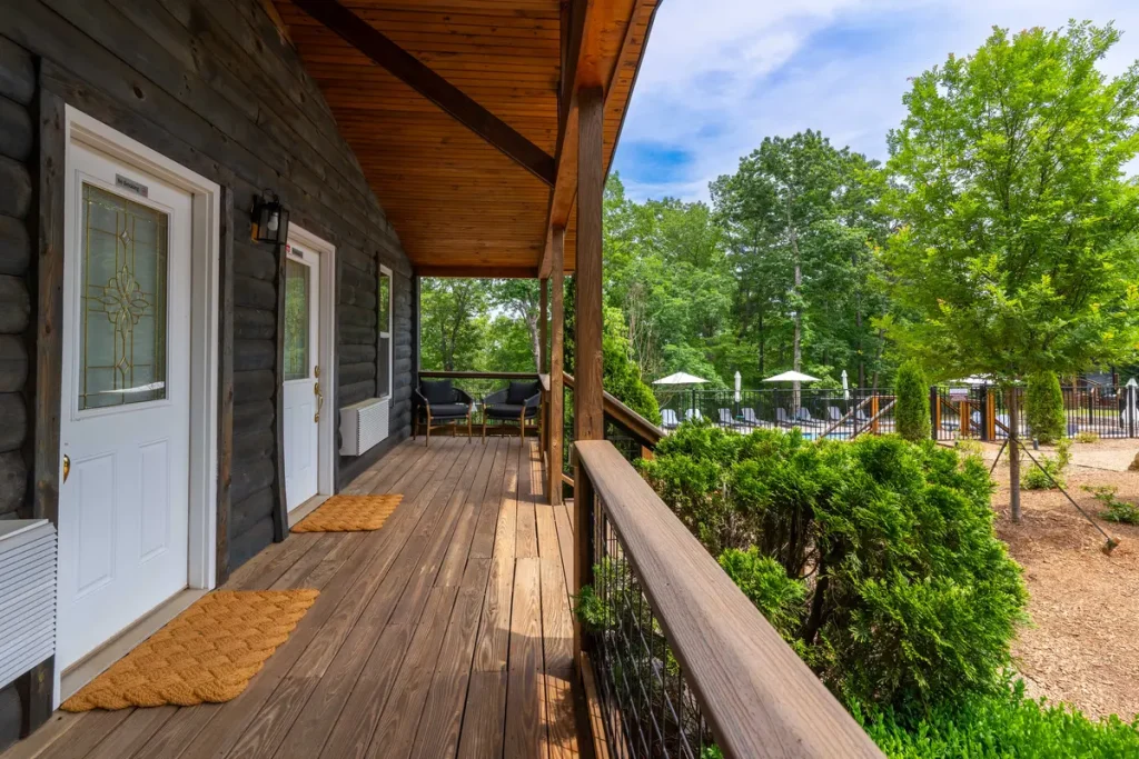 Shared covered porch and common area view outside Garden Studio A at The Shaded Crest in Lake Lure, North Carolina