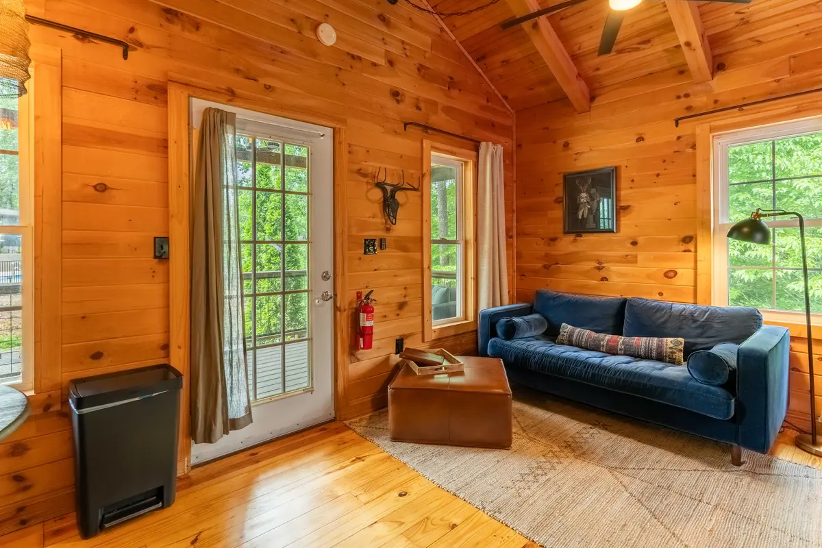 Kitchen and living area inside The Perch cabin at The Shaded Crest in Lake Lure, North Carolina