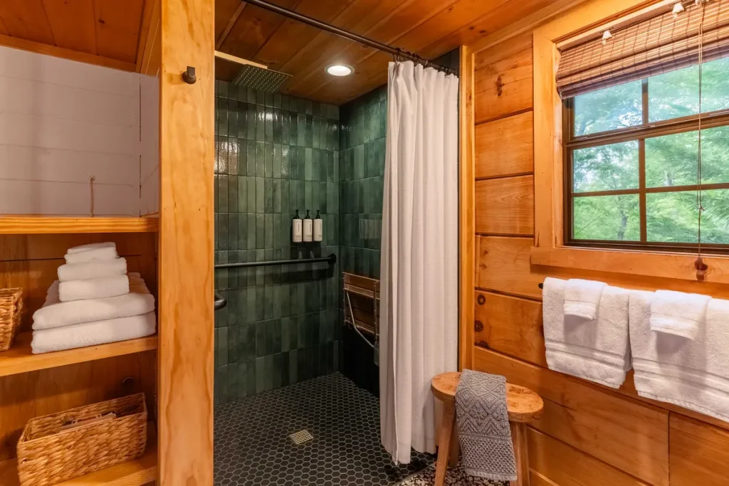 Bathroom with walk-in shower inside The Roost cabin in Lake Lure, North Carolina