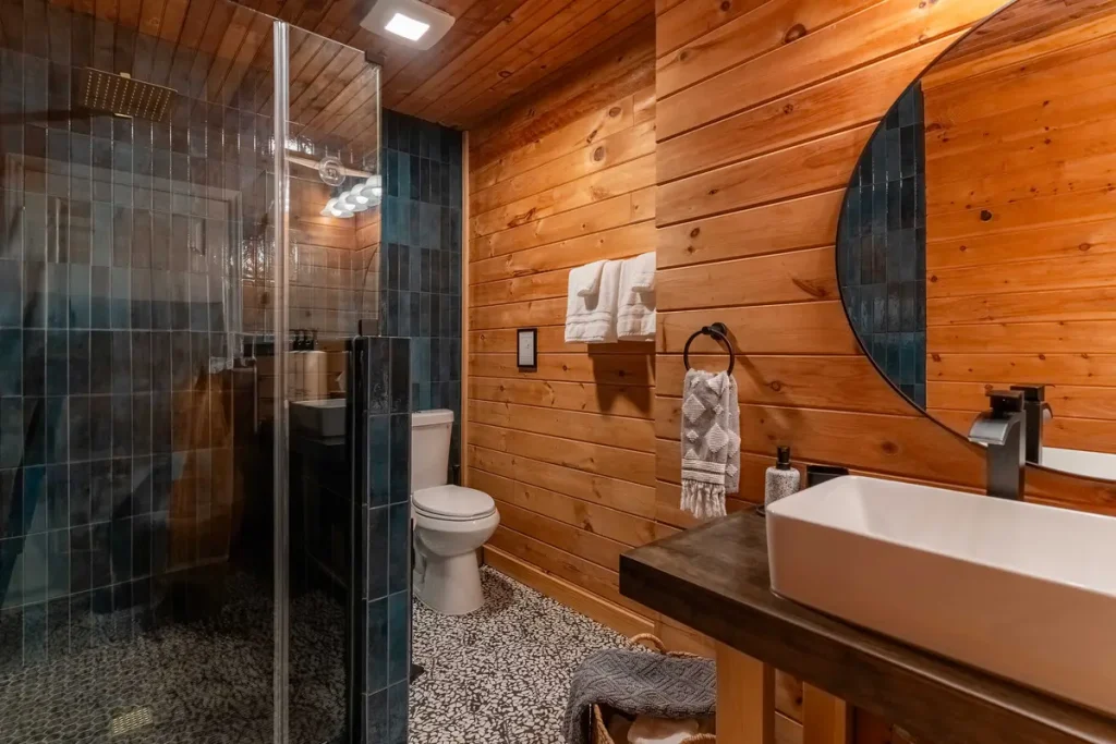 Bathroom with walk-in shower inside The Snug cabin in Lake Lure, North Carolina