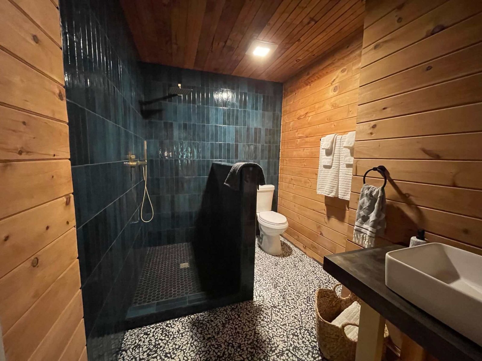 Bathroom with a walk-in rain shower with a spa-like experience.