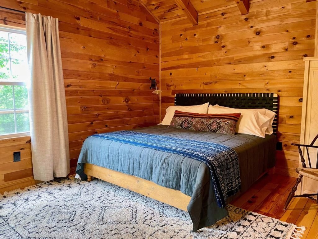 King bedroom with window inside The Perch cabin at The Shaded Crest in Lake Lure, North Carolina
